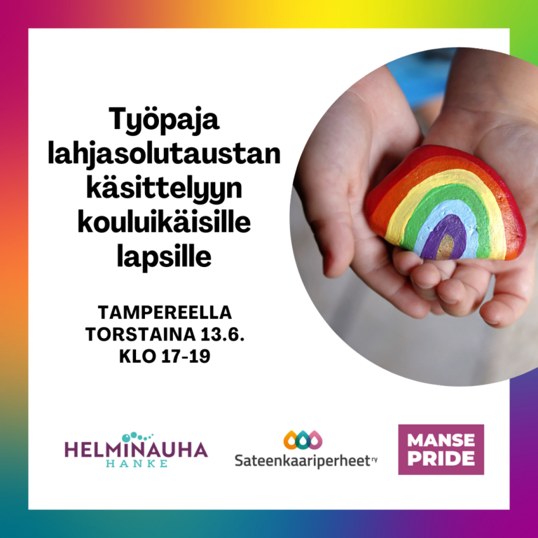 Lapsi pitää käsissään kiveä, johon on maalattu sateenkaari.